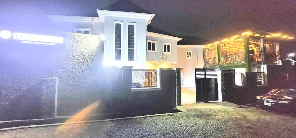 LUJ Hospitality lit up at night on the Ijokodo Apete axis